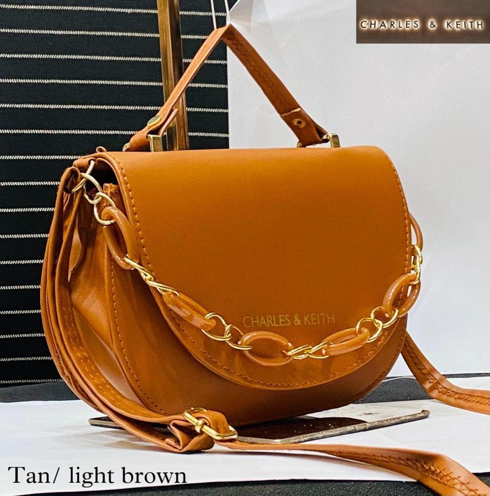 Circular Elegance: Round Shape Sling Bag with Plastic Design Chain